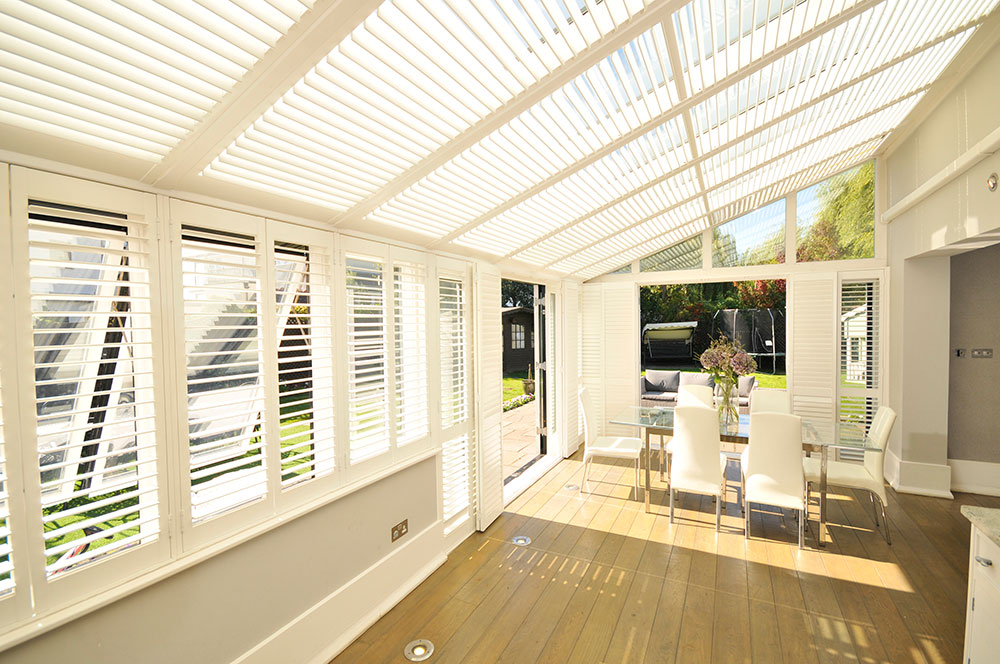 large white conservatory with shutters