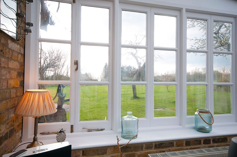double glazed white paneled windows in home
