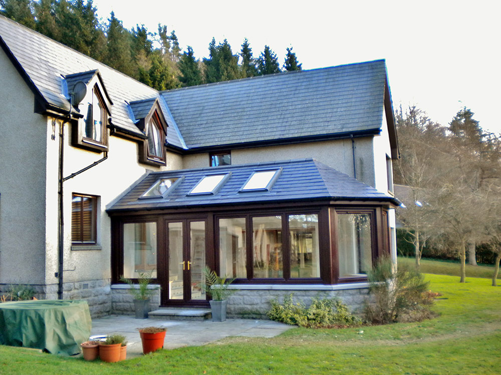 wooden conservatory with three skylights